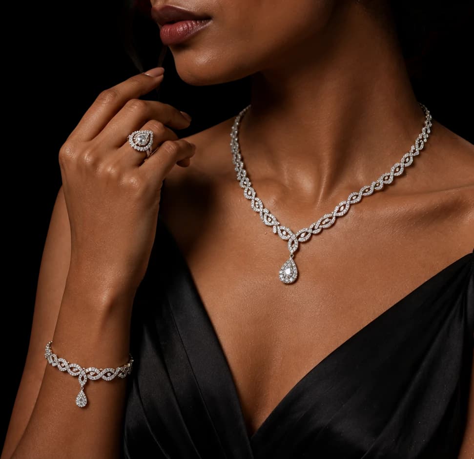 Model wearing a diamond neckset, ring and bracelet